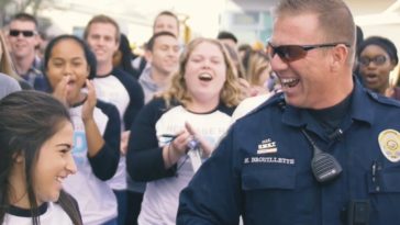 Massive mob overwhelms school's favorite police officer!
